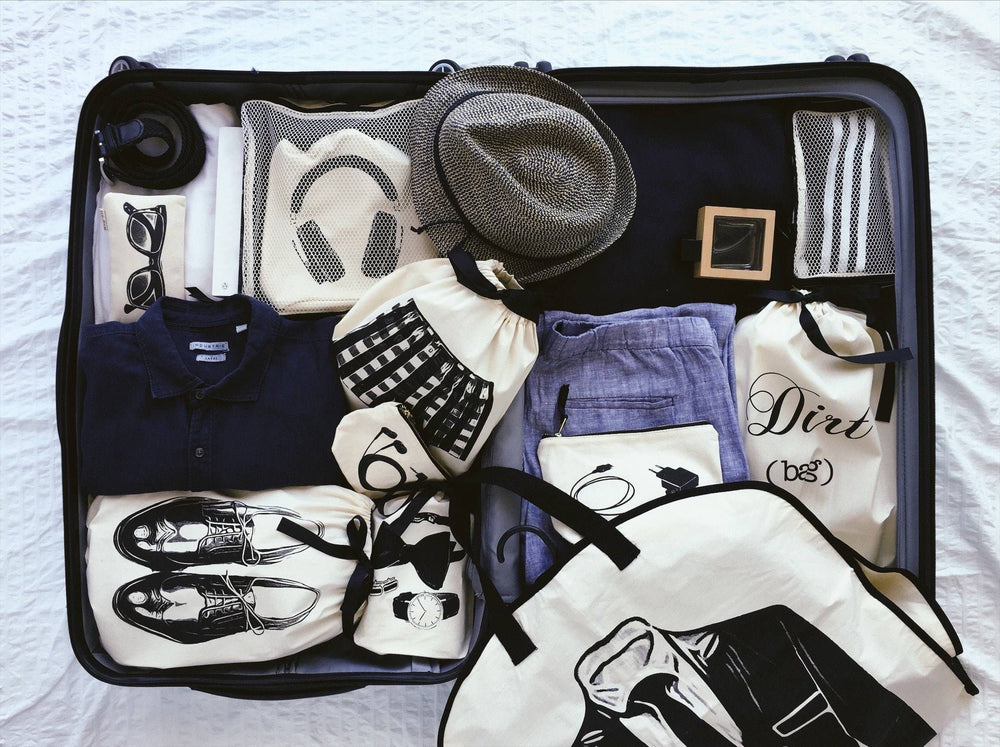 
                                      
                                        Valise pour homme avec sacs à vêtements, sacs de rangement pour vêtements, mocassins et cubes d'emballage.
                                      
                                    